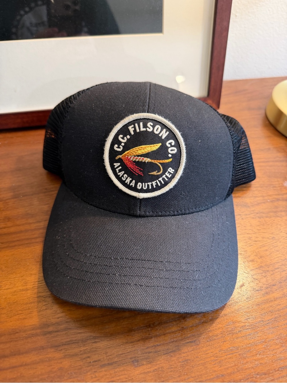 Filson Black Trucker Hat with Alaska Outfitter Patch